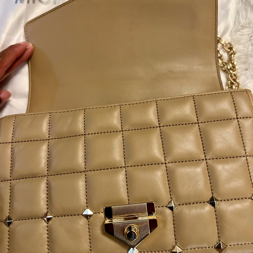 Michael Kors purse. Used on 2 times. Can be used as shoulder or crossbody bag.